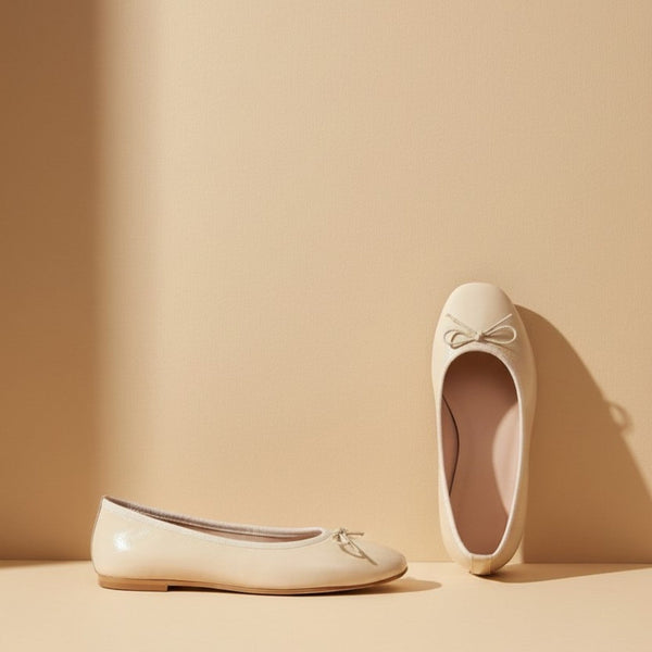 André ecru leather ballet flats with a square toe and delicate bow detail. Comfortable and chic.