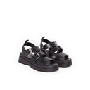 Sandales André Adonis en cuir noir avec brides à boucles et semelle plateforme crantée pour un look estival tendance