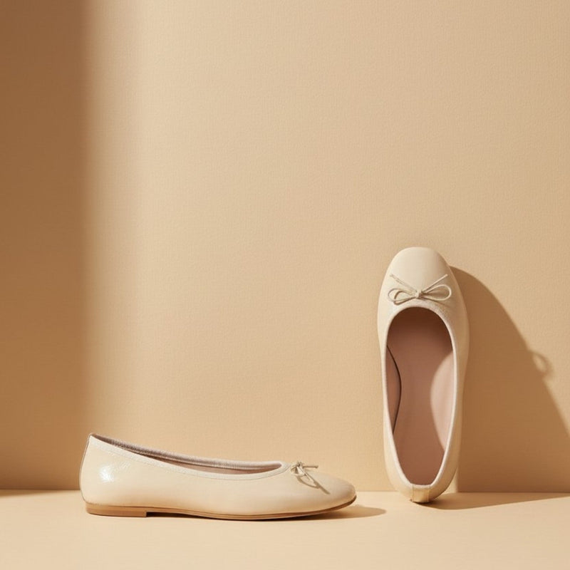 André ecru leather ballet flats with a square toe and delicate bow detail. Comfortable and chic.