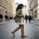 André INGRID sable suede knee-high boots with delicate stitching detail and a low heel.