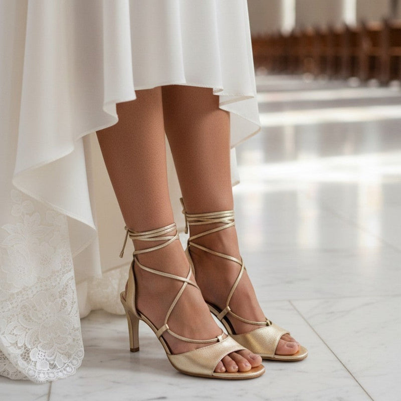 André KARMINA gold leather heeled sandals with ankle ties and delicate straps, 8cm heel.