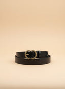André Luma black genuine leather belt with a gold oval buckle, perfect for jeans or dresses.
