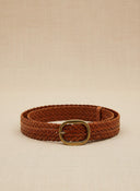 André Nerea camel braided genuine leather belt with antique gold buckle. Adjustable fit for a refined bohemian-chic style.