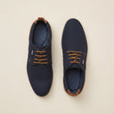 André chaussures homme bleu marine en matière synthétique effet textile avec lacets marron et empiècement camel.