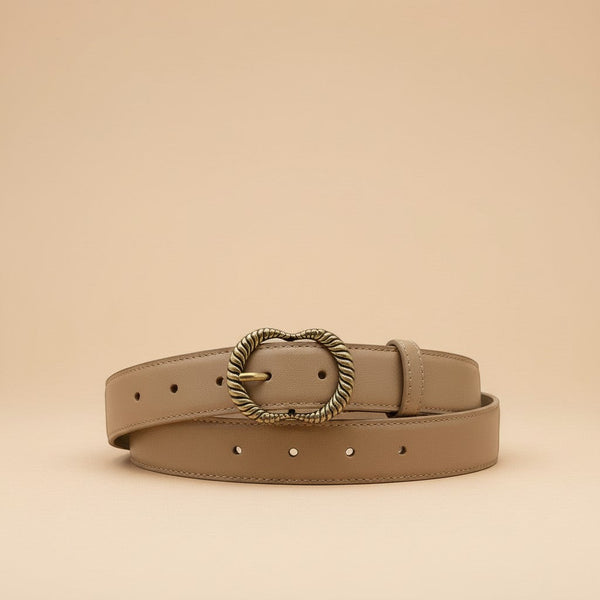 André Zestia beige genuine leather belt with ornate gold heart-shaped buckle. Minimalist design for natural elegance.